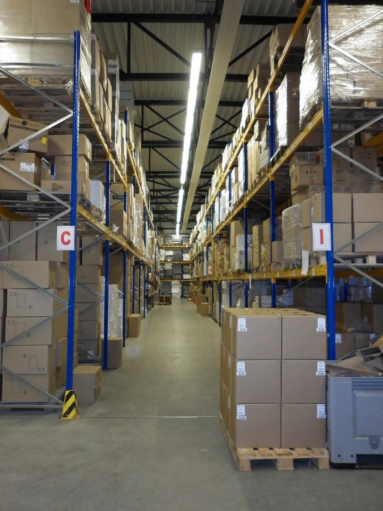 Warehouse aisle with palletised returns awaiting grading